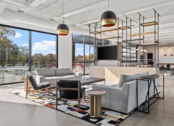 a living room with couches and chairs and a table