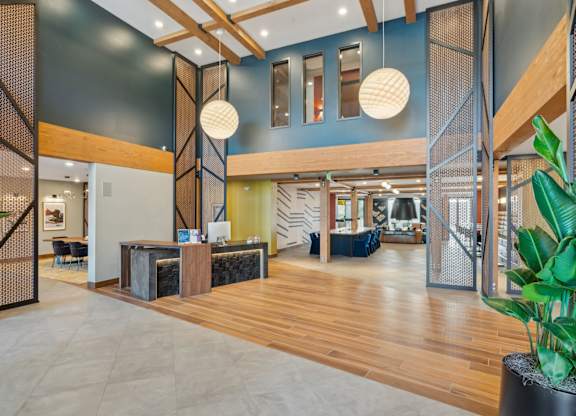 A reception area with a wooden floor and a reception desk.