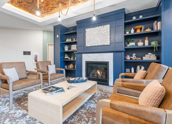 a living room with blue walls and a fireplace