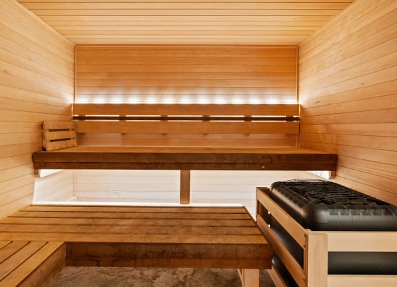 a wooden sauna with benches and a bench seat