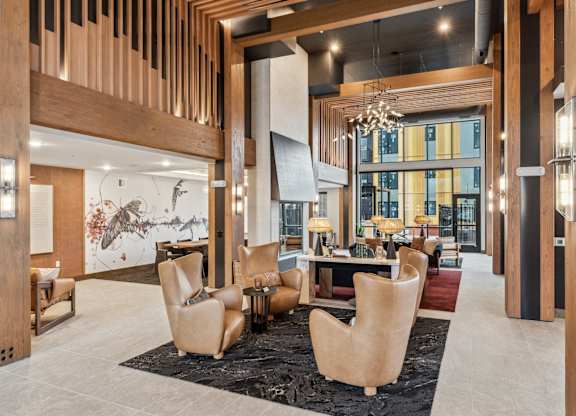 A modern living room with a large table and chairs.
