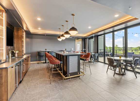 A modern kitchen with a dining table and chairs.