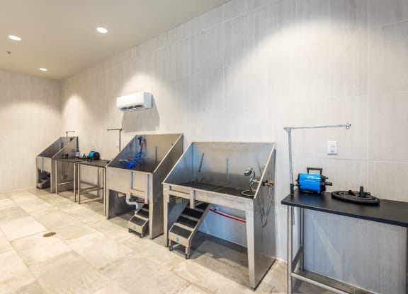 a kitchen with two stainless steel sinks and a counter top with a stove and a