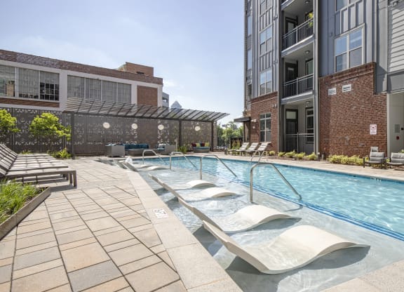 pool with aquatic chairs