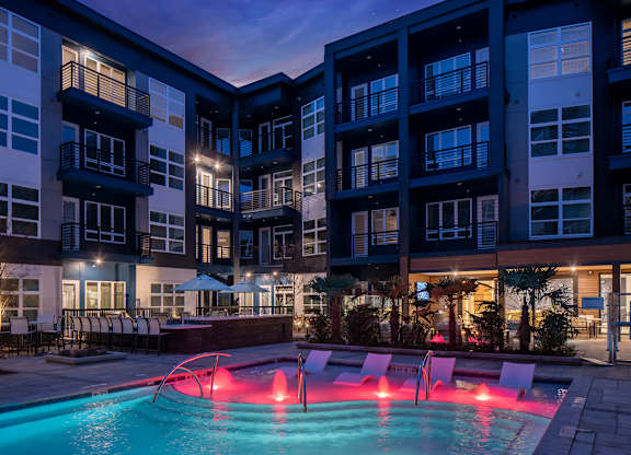 A swimming pool with a red light in the middle of it.