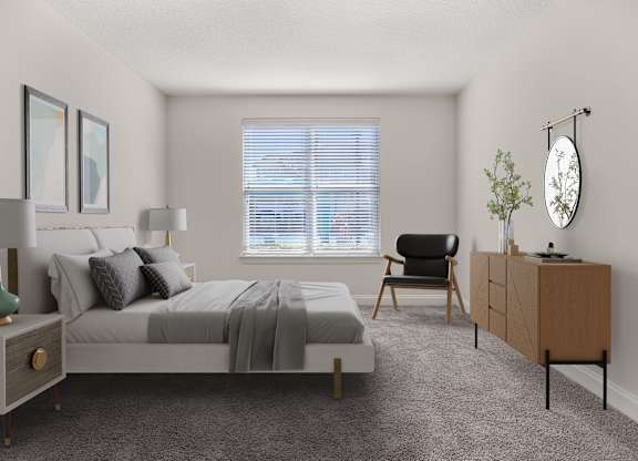 A bedroom with a bed, chair, and a cabinet.