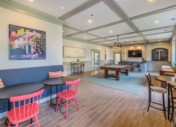 Clubhouse lounge game room with billiards and shuffleboard