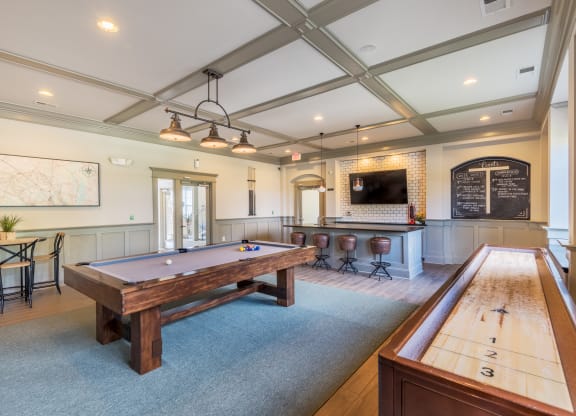 Clubhouse lounge game room with billiards and shuffleboard