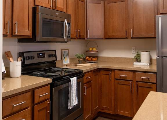 Four Seasons Logan Apartments and Townhomes Black Appliances in Kitchen