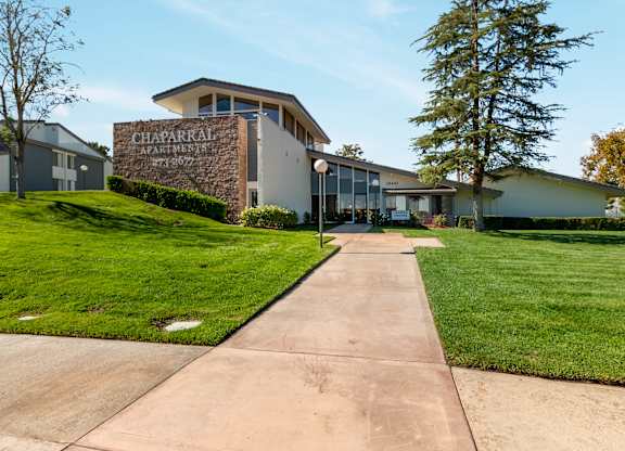A building with the sign Chaparral Apartments on it at Chaparral Apartments, Palmdale, California