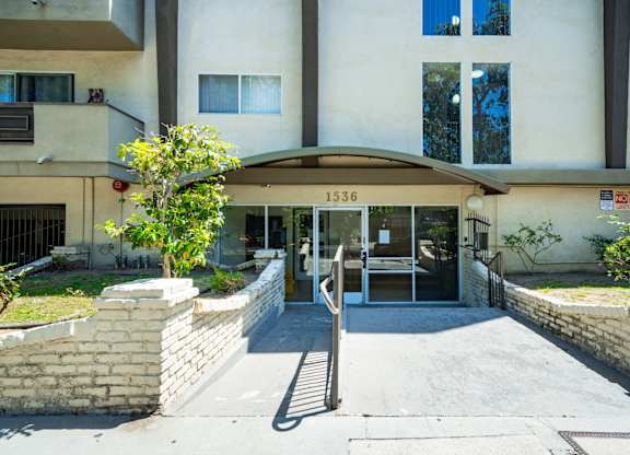 The image shows the front of a building with the number 1536 on it.