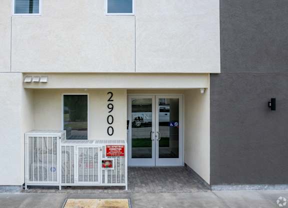 A white building with the number 2900 on the front.
