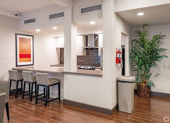 A room with a bar and a potted plant at Oak Park Apartments, Monrovia, 91016