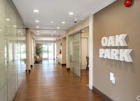 A hallway with the words at Oak Park Apartments, Monrovia, 91016
