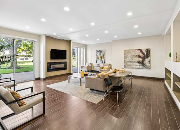 A modern living room with a fireplace and a television.