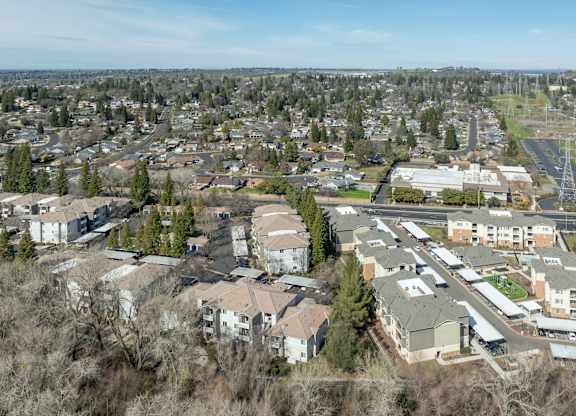 A bird's eye view of a residential area with houses and trees.