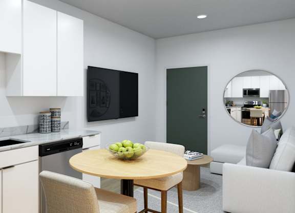 A modern kitchen with a table and chairs.