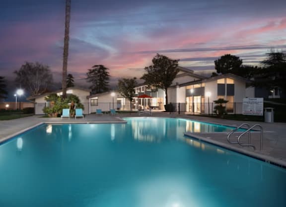 A swimming pool at a residential area during twilight at Chaparral Apartments , California