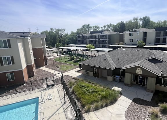 A sunny day at the apartment complex with a swimming pool.