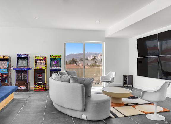 a living room filled with furniture and a flat screen tv