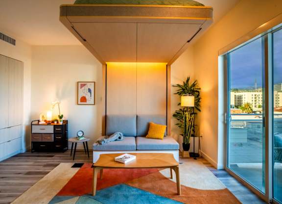 a living room with a couch and a table