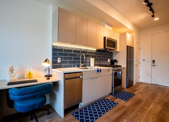 a kitchen with a counter top and a sink