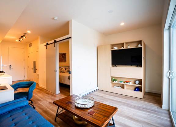 a living room with a couch and a table