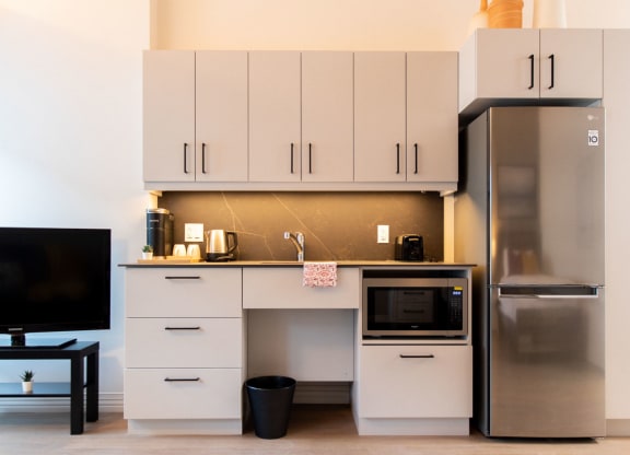 a white kitchen and fridge