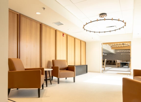 a waiting room with chairs and a table