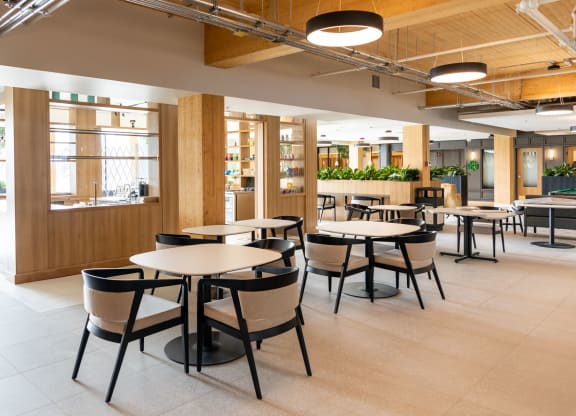 a dining area with tables and chairs