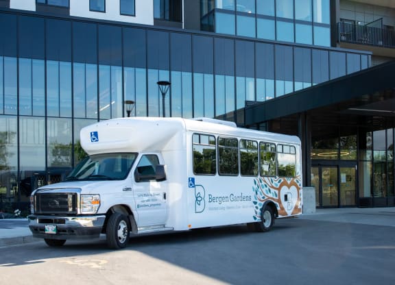 a bus parked in front of a building