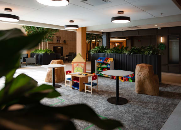 a room filled with furniture and a large window