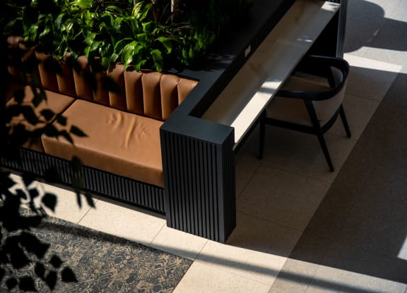 a close up of a bench with a chair next to it