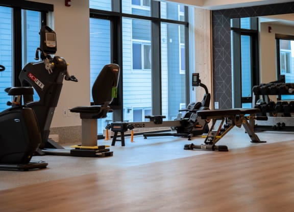 a room filled with lots of different types of exercise equipment