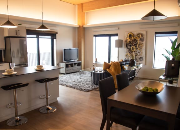 a kitchen and living room in a 555 waverly unit
