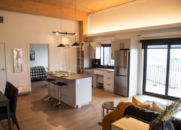 a kitchen and living room in a 555 waverly unit