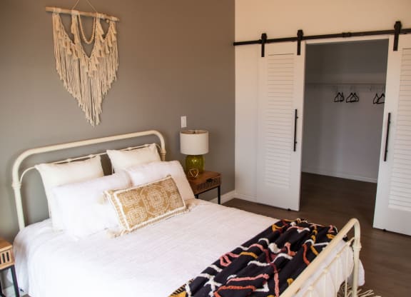 a bedroom with a bed and a closet