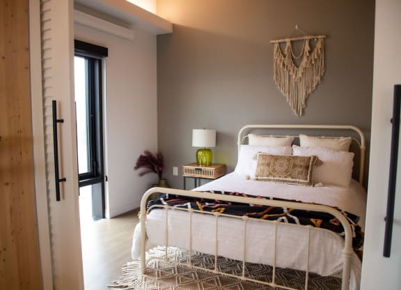a bedroom with a bed and a door
