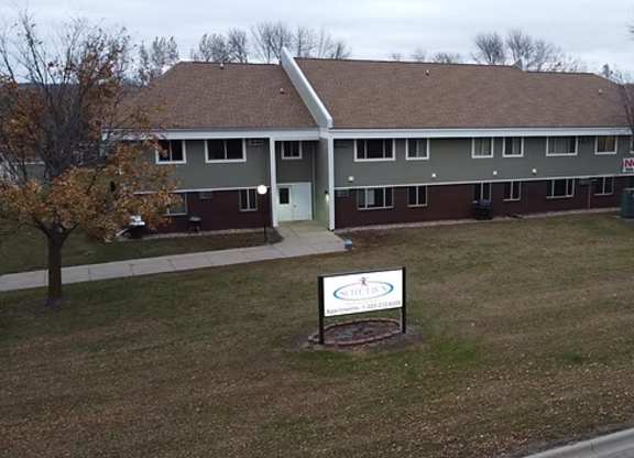 A building with a sign in front of it.