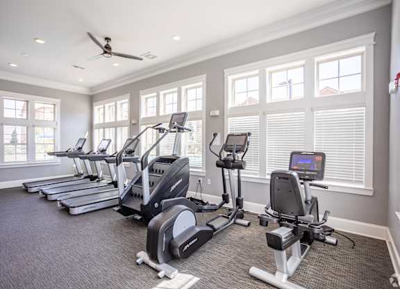 the gym is equipped with state of the art cardio equipment and windows