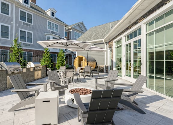 Resident outdoor patio with lounge seating at The Rail North Bergen