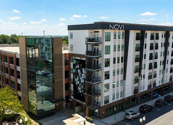 A modern building with the word NOVI on the side.