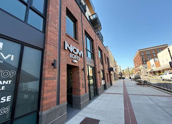 A street view of a building with the name INOM LOFIS on it.