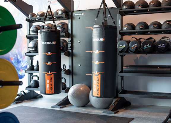 Punching bag and weights at Novi Flats' fitness center