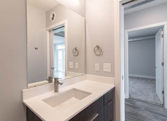 Looking into a bedroom from a bathroom
