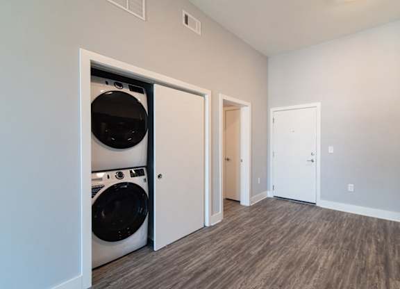 Full-sized, front-loading washer and dryer at Novi Flats luxury apartments in Concord, NC