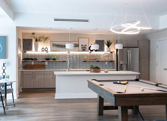 The resident lounge and game room at Novi Rise Apartments in Concord, NC