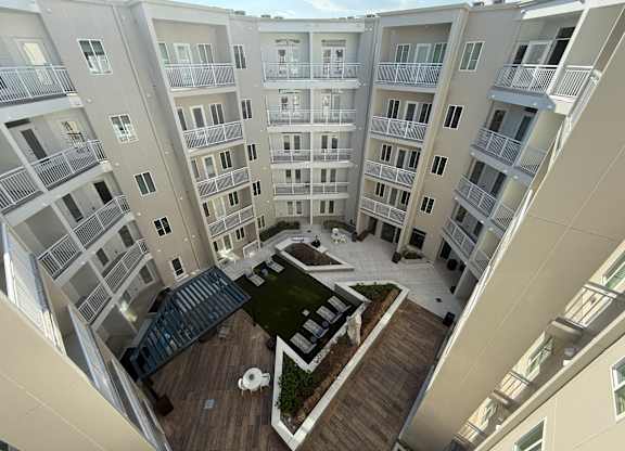 Apartment complex with a courtyard in the middle.