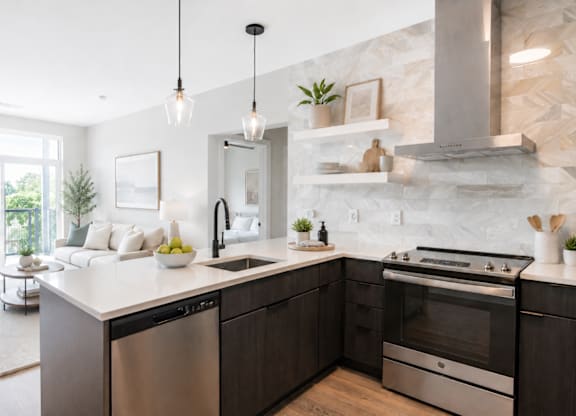 A modern kitchen with dark wood cabinets and stainless steel appliances.