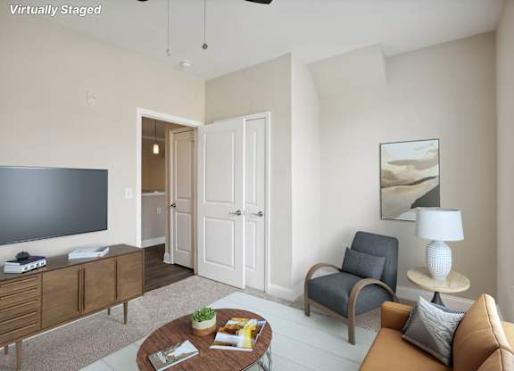 a living room with a couch and a tv